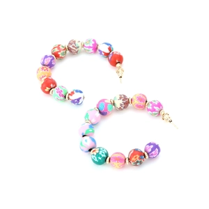 Bohemian C-shaped hoop earrings featuring colorful patterned beads and gold studs