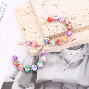 Bohemian C-shaped hoop earrings with colorful floral beads and gold spacers for women