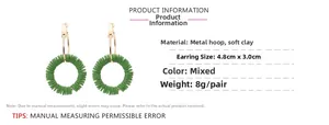 Detail view of handmade gold hoops with green polymer clay beads and dimensions 4.8x3.0cm