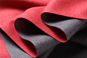 Close-up of double-sided cashmere scarf showing red and grey wool blend texture