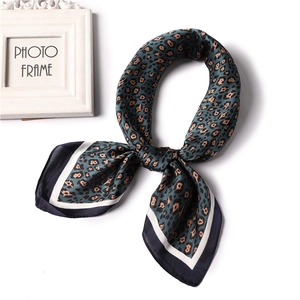 Classic leopard print silk square scarf with dark green base and chic border design