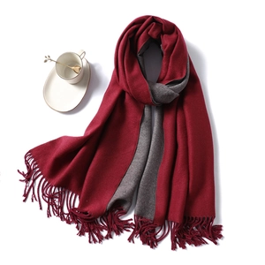 Detail of burgundy and dark gray double-sided scarf with twisted tassel fringe