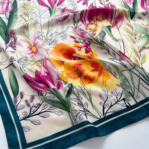 Close-up of soft floral pattern silk scarf showing rich tulip prints and fabric texture
