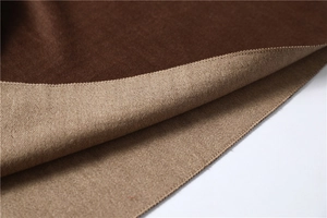Close-up of double-sided knit scarf showing brown and camel textures with neat edges