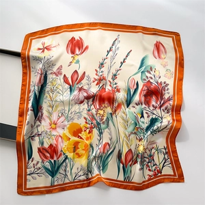 Detail of tulip floral print silk scarf showing smooth texture and edge stitching