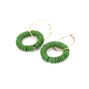 Bohemian gold hoop earrings with dark green clay discs in a handmade ethnic style