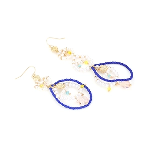 Handmade bohemian beaded hoop earrings with pearls and crystals in a vacation style