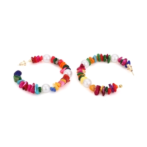 Detail of bohemian hoop earrings with colorful gravel stones and white pearls