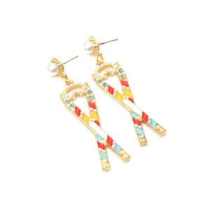 Exaggerated colorful enamel ribbon earrings with pearls and rhinestones on white base