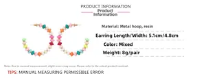 Detail showing dimensions and mixed color beads of the C-shaped hoop earrings