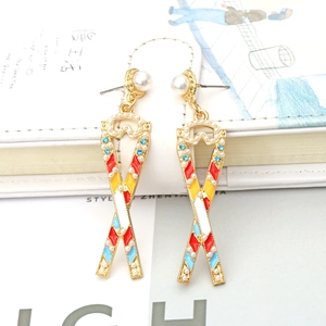 Bohemian dangle earrings with colorful enamel, blue crystals and pearls in gold alloy