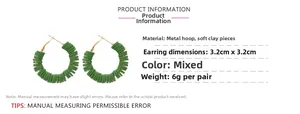 Detail view of bohemian round hoop earrings with green polymer clay discs and metal frame