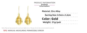 Detail view of gold floral drop earrings with hammered texture and dimensions specification