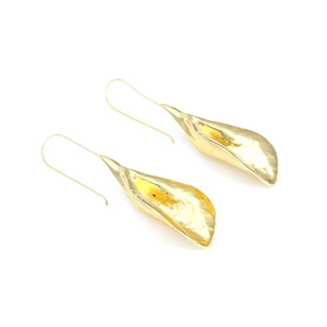 Detail of gold leaf earrings showing hammer texture and organic petal shape details