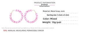 Detail view of 5.5cm pink resin heart hoop earrings with dimensions and weight data