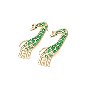 Detail of giraffe earrings with golden metal and green enamel spots on white background