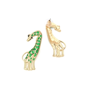 Pair of gold alloy giraffe earrings with green enamel spots on a clean white background