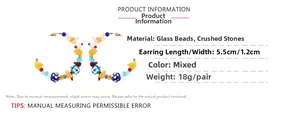 Detail view of colorful bohemian C-shaped earrings with glass beads and gravel stones