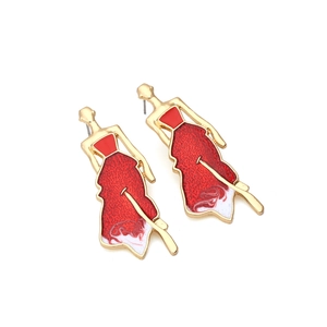 Golden earrings featuring abstract woman figure with vibrant red enamel dress design