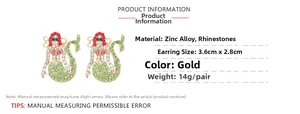 Detail of mermaid earrings with colorful rhinestones on polished gold zinc alloy