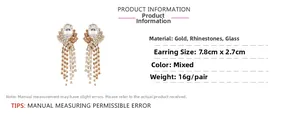Detailed view of long gold tassel earrings showing 7.8cm length and 2.7cm width dimensions