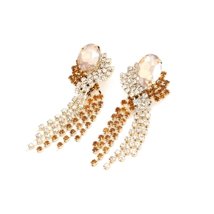 Gold-plated tassel earrings featuring amber crystals and shimmering rhinestone fringes