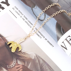 Chic alloy chain necklace with crystal banana pendant and pearls in a luxury setting