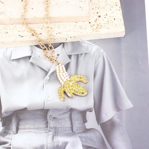 Fashion banana pendant necklace with yellow rhinestones and white pearls on gold chain