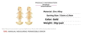 Detail view of gold fishbone earrings showing 7.3cm size and weight specifications