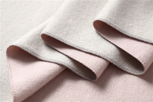 Macro shot of double-sided grey and pink pashmina scarf with premium edge stitching