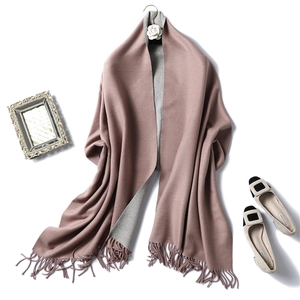 Detail of pink and grey reversible cashmere-style scarf with tassel fringe edges