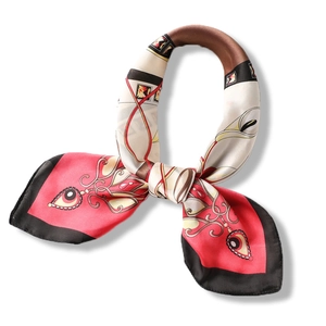 70cm silk-like square scarf with red and beige geometric patterns tied in a bow