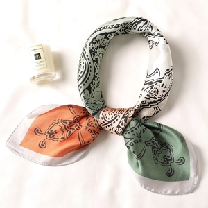 Satin square scarf with vintage paisley pattern and two-tone gradient draped in a circle