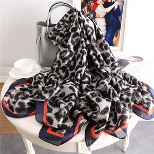 Classic leopard print silk scarf with navy and orange contrast borders for women