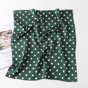 Dark green satin square scarf with white polka dot pattern and smooth silk texture