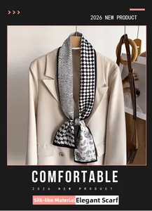 Detail of checkered and houndstooth pattern silk scarf styled with a beige suit blazer