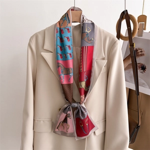 Equestrian print narrow silk scarf styled on beige suit with horse and saddle motif