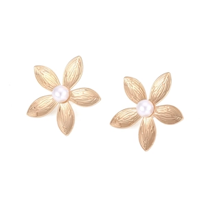 Vintage gold flower earrings with pearls in Bohemian style shown on white background