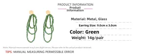Detailed view of green glass beaded fringe earrings with dimensions 9cm by 3cm
