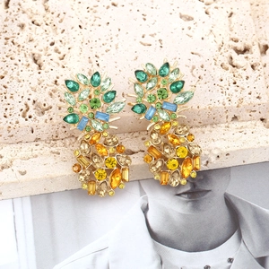 Fashion crystal pineapple earrings with green and golden rhinestones in gold setting