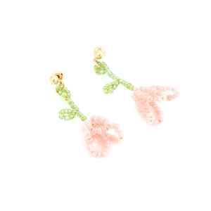 Handmade beaded tulip flower earrings in pink and green with gold studs on white background
