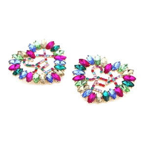 Detailed macro view of heart-shaped earrings with colorful rhinestones and gold alloy frame