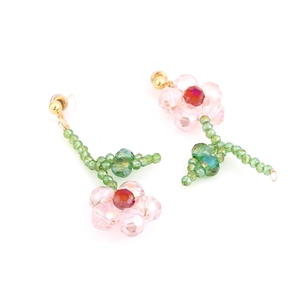 Handmade asymmetrical pink crystal flower drop earrings with green beaded leaf and stem