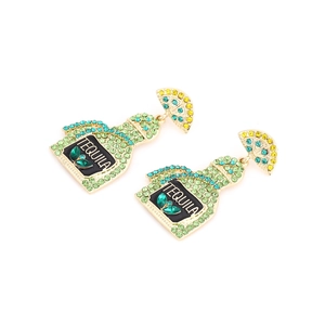 Close-up of tequila bottle earrings with green rhinestones and lemon slice details