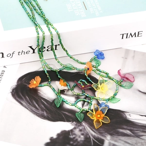 Handmade green beaded multilayer flower necklace with colorful resin floral pendants