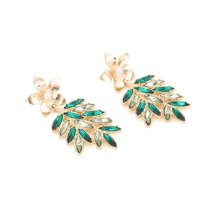 Vintage gold earrings with green crystal leaves and floral pearl studs in retro forest style