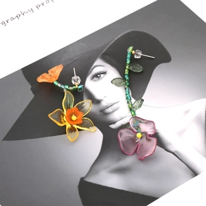 Asymmetric handmade floral earrings with resin beads and colorful gradient petals
