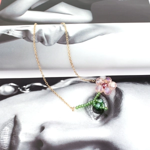 Handcrafted floral pendant necklace with pink crystal petals on a fine gold chain