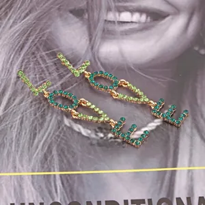 Chic long LOVE letter earrings with teal and green rhinestones on gold alloy base