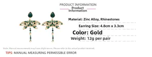 Detail of green rhinestone dragonfly earrings with gold alloy and measurement markers